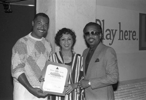 Shelly Garrett and Gertrude Gipson holding awards, Los Angeles, 1989