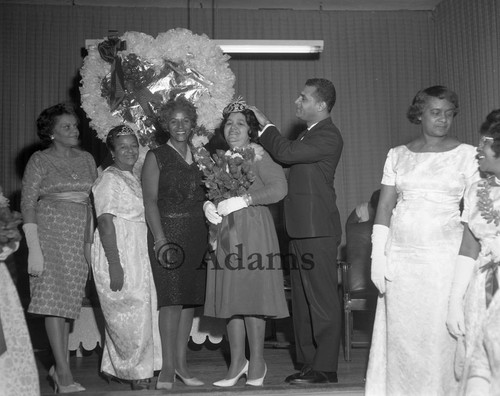 Mills crowning women, Los Angeles, 1963