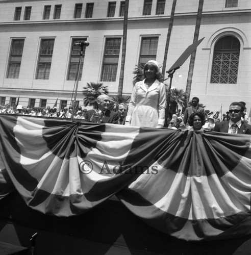 Ethel Bradley standing before a crowd during her husband's inauguration as mayor, Los Angeles, 1973