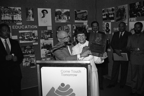 Miriam Matthews receiving an award from Gus Hawkins, Los Angeles, 1984
