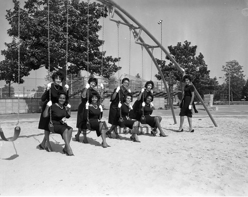 Women on swings, Los Angeles, 1962