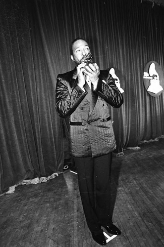 Marvin Gaye kissing his Grammy at the 25th Annual Grammy Awards, Los Angeles, 1983