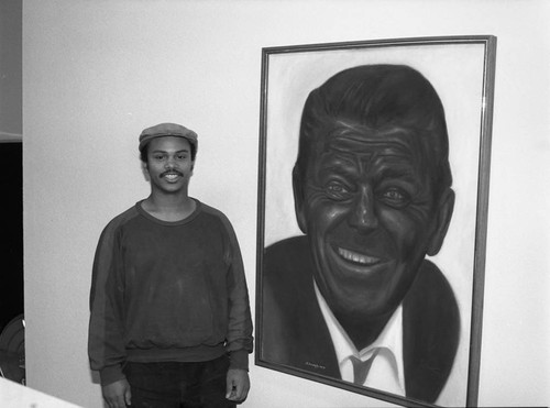 Al Hornsby standing near his portrait of Ronald Reagan, Los Angeles, 1986