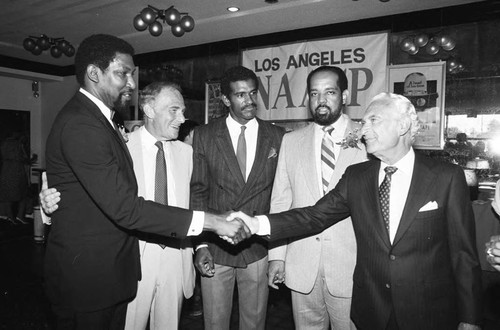 Guests at the premiere of "The Jesse Owens Story" greeting each other, Los Angeles, 1984