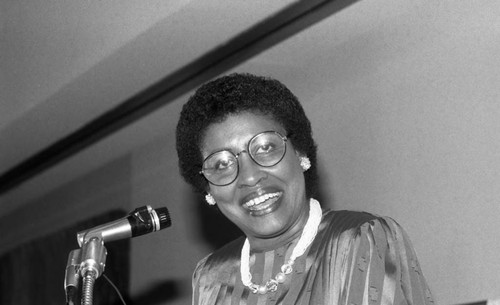 Woman speaking during a Martin Luther King Birthday Celebration Week event, Los Angeles, 1985