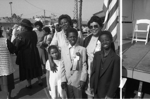 Participants posing at the opening of the Martin Luther King Jr. Shopping Center, Los Angeles, 1984