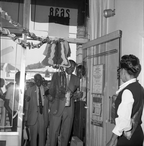 Tom Bradley entering a store front office during his mayoral campaign, Los Angeles, 1969