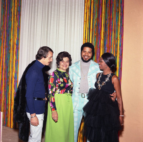 Gwen Gordy Fuqua and others posing together at a party, Los Angeles