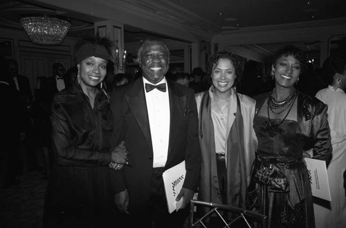 Beverly Todd, Denise Nicholas, and Paul Kelly posing together at the Black Emmy nominees dinner, Los Angeles, 1989