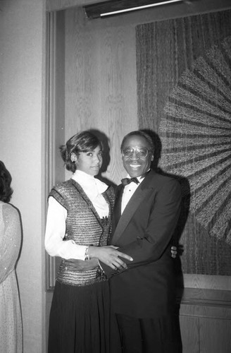 Robert Guillaume posing with an unidentified woman at the 17th Annual NAACP Image Awards, Los Angeles, 1984