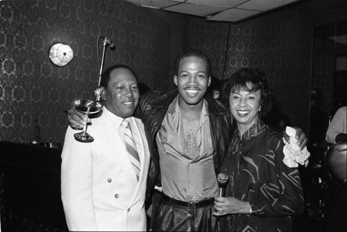 Freddie Jett and Gertrude Gipson posing with an unidentified man at the Pied Piper nightclub, Los Angeles,1983