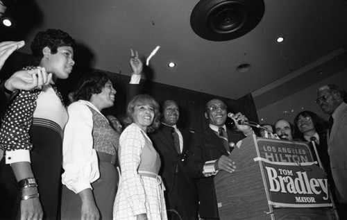 Tom Bradley and his family celebrating his election on stage at the Hilton Hotel, Los Angeles, 1973