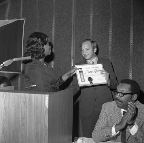 Mary Lee Baker presenting an Award of Merit to Albert Cherry, Hawthorne, California, 1973