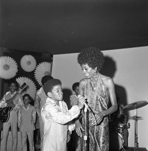 Diana Ross talking with Michael Jackson on stage, Los Angeles, 1969