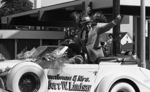 Gilbert Lindsay riding in car during the South Central Los Angeles Easter Parade, Los Angeles, 1983