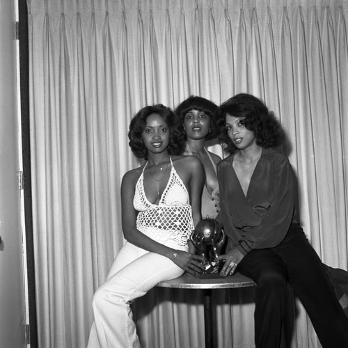 Women posing with an NAACP Image Award, Los Angeles, 1978