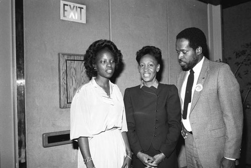 Maxine Waters posing with others at the 5th annual California Black Health Network conference, Los Angeles, 1984