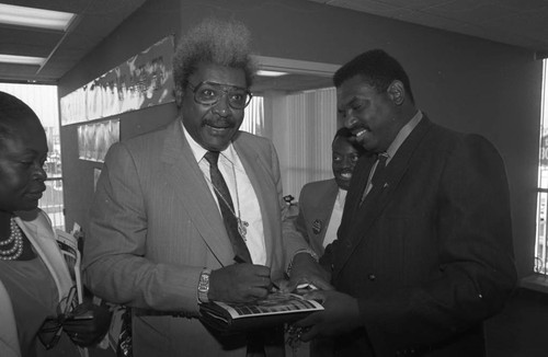 Black Business Association members talking with Don King, Los Angeles, 1991