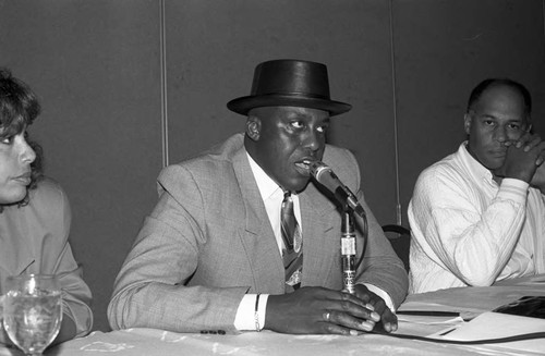 Bill Duke speaking on a panel at a Black Women's Forum event, Los Angeles, 1991