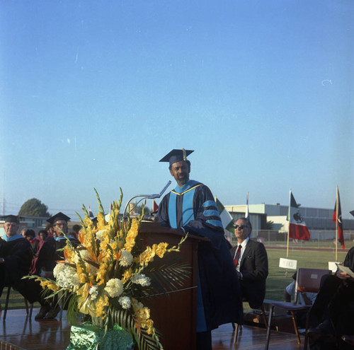 Dr. Abel B. Sykes, Jr. speaking at the commencement ceremony for Compton College, Compton, 1972