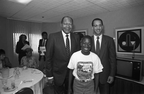 Big Brother Shelter event participants posing with Tom Bradley, Los Angeles, 1989