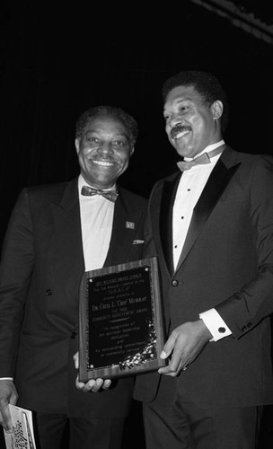 Dr. Cecil Murray receiving an award at the NAACP Awards Dinner, Los Angeles, 1986