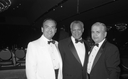 John Mack posing with guests during the Urban League's Whitney M. Young, Jr. Awards Dinner, Los Angeles, 1988