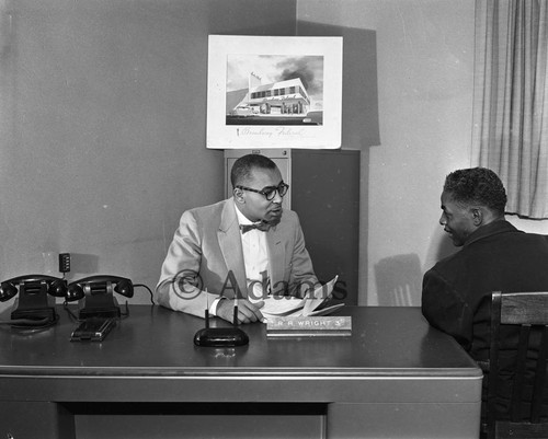 Businessmen in conversation, Los Angeles, 1955