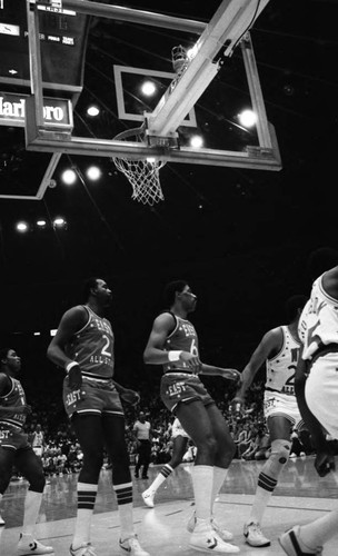 Moses Malone and Julius Erving guarding the basket during the NBA All-Star Classic, Inglewood, 1983