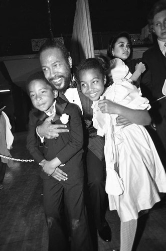 Marvin Gaye hugging his children at the 25th Annual Grammy Awards, Los Angeles, 1983