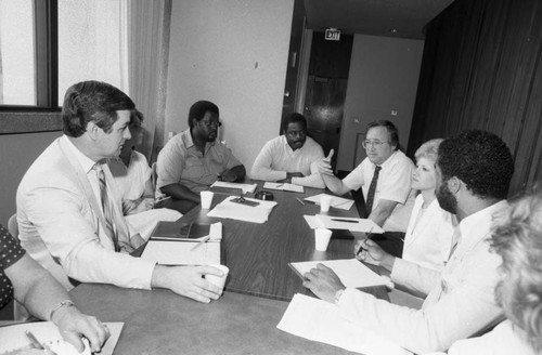 Community Youth Gang Services meeting attendee engaging in discussion, Los Angeles, 1983