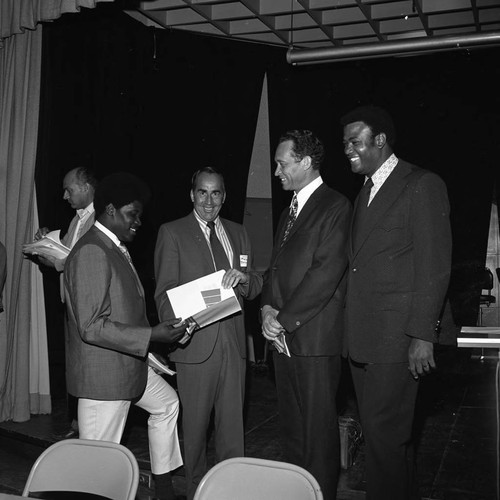 Douglas Dollarhide talking with others during an event at Compton College, Los Angeles, 1972