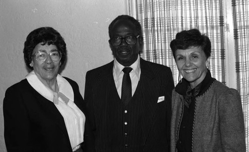 Harry Gipson posing with Pat Russell at a Consolidated Realty Board breakfast, Los Angeles, 1987