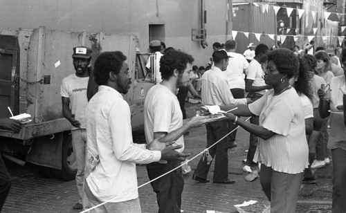 Friends feeding friends, Los Angeles, 1986