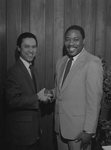 Paul C. Hudson posing with Charles R. Anderson, Los Angeles, 1986