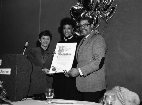 Pat Russell and David S. Cunningham, Jr. posing with and Lois Anderson, Los Angeles, 1989