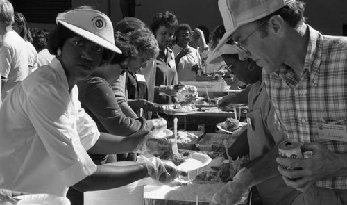 Friends feeding friends, Los Angeles, 1986