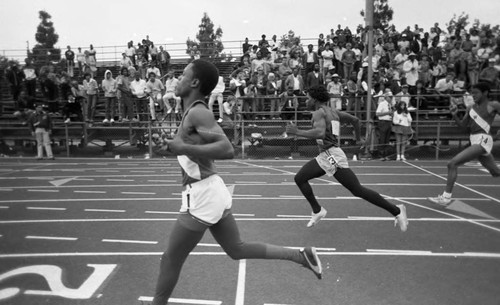 Runners crossing the finish line at Birmingham High School, Los Angeles, 1983