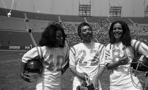 Judy Pace, Oscar Brown Jr., and Marylin McCoo posing together at the Freedom Classic pre-game, Los Angeles, 1973