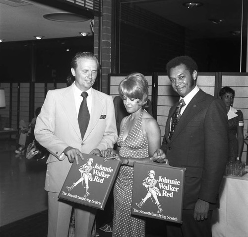 John Mack standing with Urban Leaque Freedom Classic supporters, Los Angeles, 1973