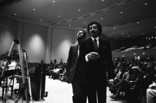 Smokey Robinson and Stevie Wonder walking from the lectern at Marvin Gaye's funeral service, Los Angeles, 1984