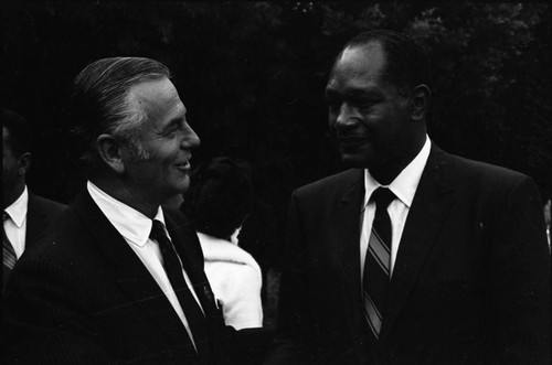 Congressman Alphonzo Bell, Jr. talking with Tom Bradley, Los Angeles, 1969