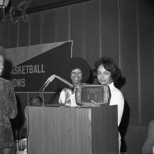 Dorothy Hogan receiving an award at the Compton College basketball awards dinner, Hawthorne, 1973