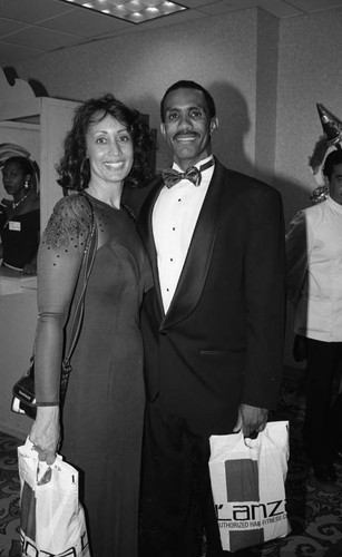 Couple posing together during "A Midsummer Night's Magic" dinner, Los Angeles, 1995