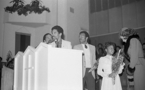 Vanessa Williams receiving a girl's bouquet during the NAACP 75th anniversary kick-off celebration, Los Angeles, 1984