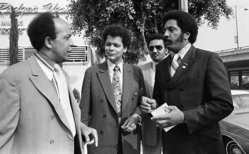 Booker Griffin talking with Julian Bond and others, Los Angeles, 1972