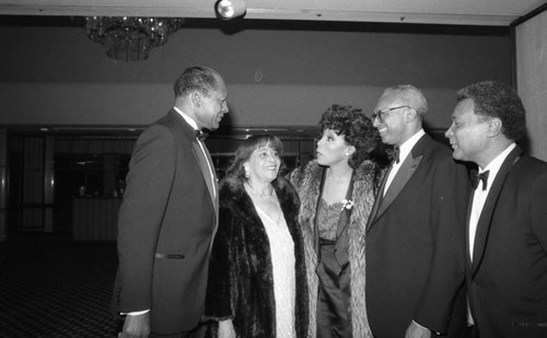 Tom and Ethel Bradley talking with Diahann Carroll and others at an awards dinner, Los Angeles, 1985