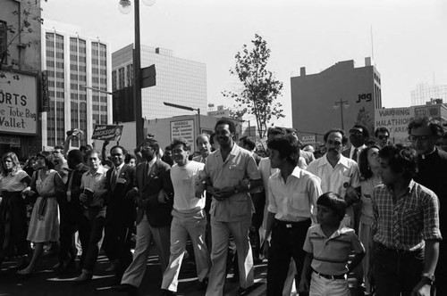 Jessie Jackson and Martin Sheen marching arm-in-arm after a Black Women's Forum event, Los Angeles, 1984