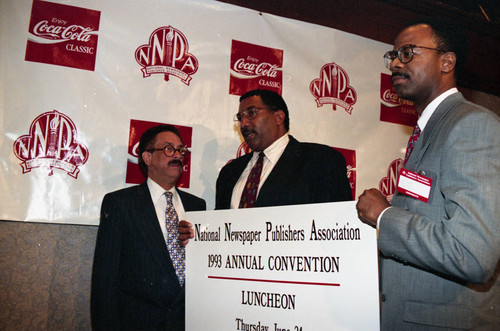 Willie Williams holding a sign at the National Newspaper Publishers Association convention, Los Angeles, 1993