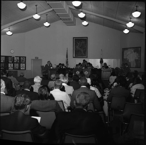 People attending a meeting at Compton City Hall, Compton, California, 1975